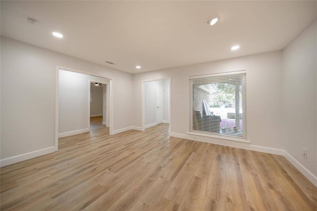 4333 Harvest Hill Road, Dallas, TX 75244 Interior space featuring wood-finish flooring, recessed lighting, and a large window with horizontal blinds