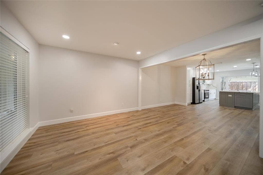 4333 Harvest Hill Road, Dallas, TX 75244 Neutral interior featuring wood-finish flooring, recessed lighting, and a suspended metal lantern fixture
