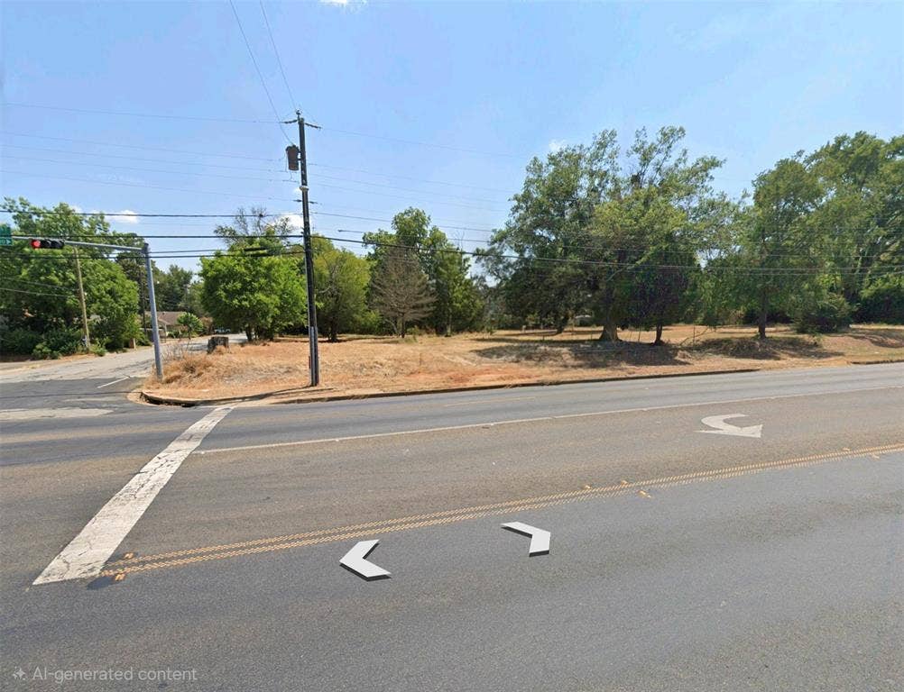 1621 E Front Street, Tyler, TX 75702 Corner lot featuring mature trees and level topography with street-level accessibility