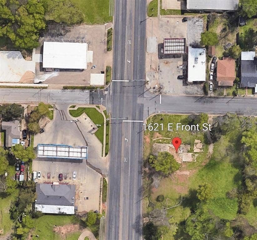 1621 E Front Street, Tyler, TX 75702 Aerial perspective featuring a corner lot with established trees and direct street access