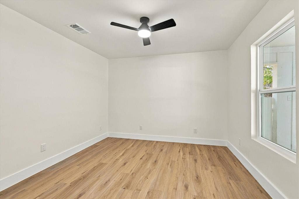 Primary bedroom with brand new flooring.