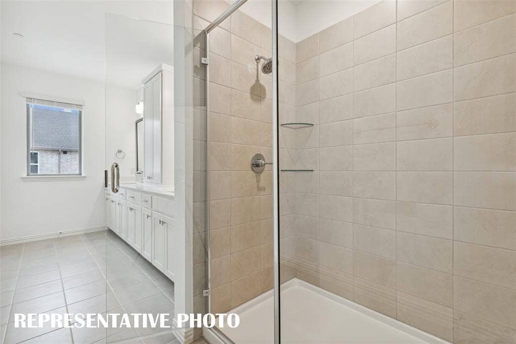 4767 Lunker Street, McKinney, TX 75071 Your new owner's bath comes complete with an oversized, walk in shower. REPRESENTATIVE PHOTO