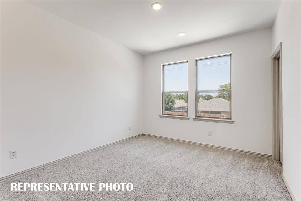 4759 Lunker Street, McKinney, TX 75071 One of two spacious secondary bedrooms in our Tatum floor plan. REPRESENTATIVE PHOTO.