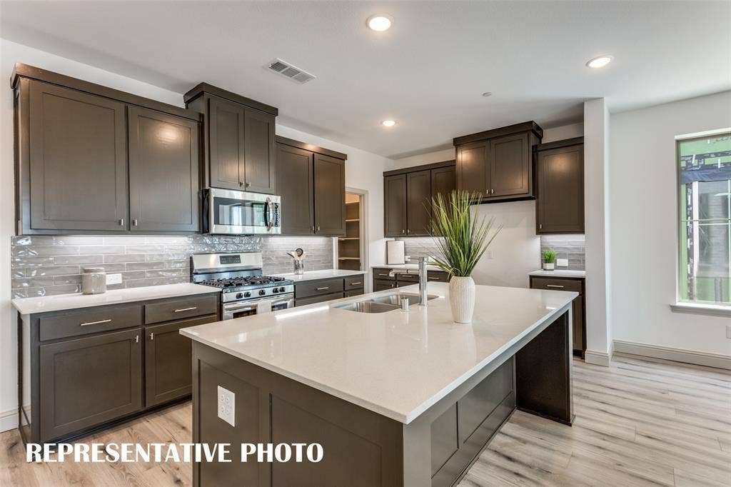 4759 Lunker Street, McKinney, TX 75071 Gorgeous cabinetry paired with stylish finishes can be found in your new dream kitchen! REPRESENTATIVE PHOTO.