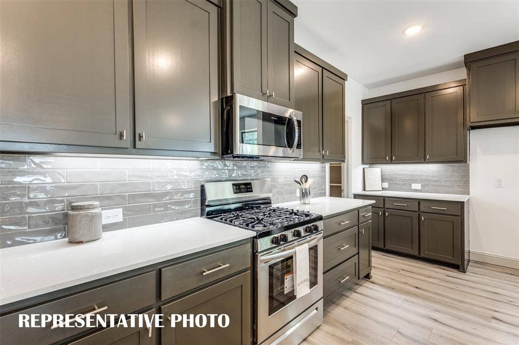 4759 Lunker Street, McKinney, TX 75071 A beautiful backsplash, stainless appliances, pot & pan drawers and so much more can be found in this over the top kitchen! REPRESENTATIVE PHOTO.