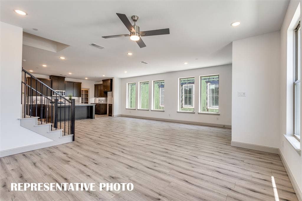 4759 Lunker Street, McKinney, TX 75071 Featuring walls of windows throughout the main floor, this beautiful home is filled with natural light. REPRESENTATIVE PHOTO.