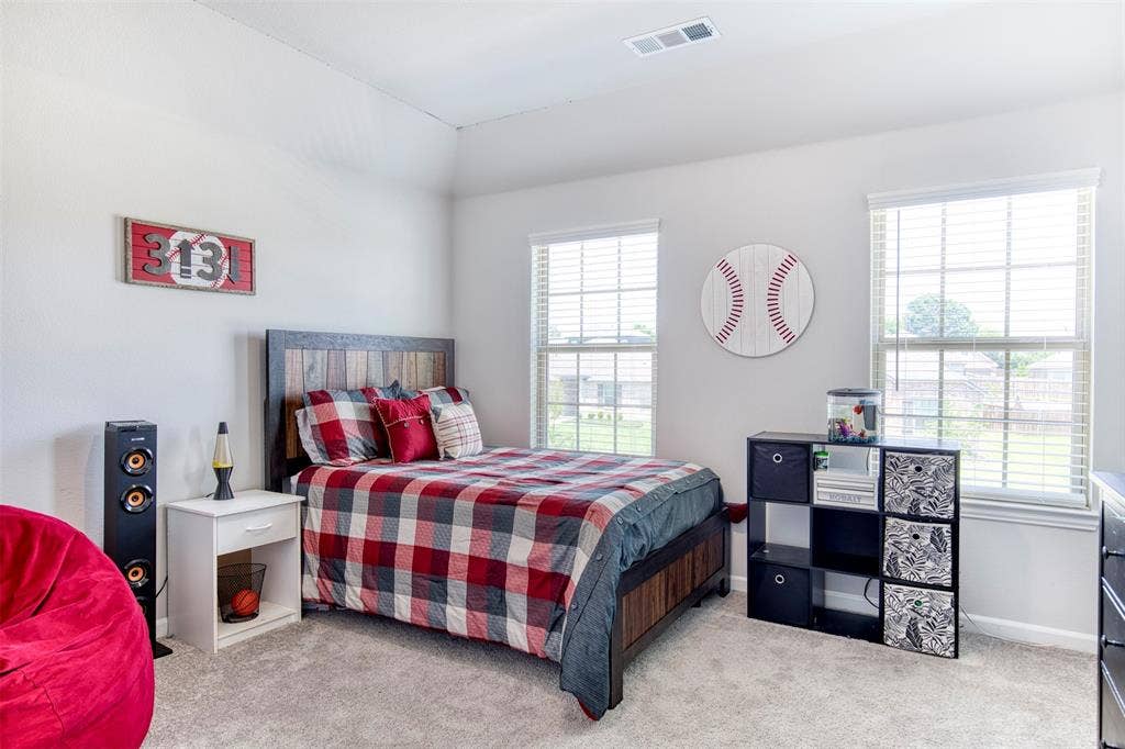 Upstairs bedroom with natural light.