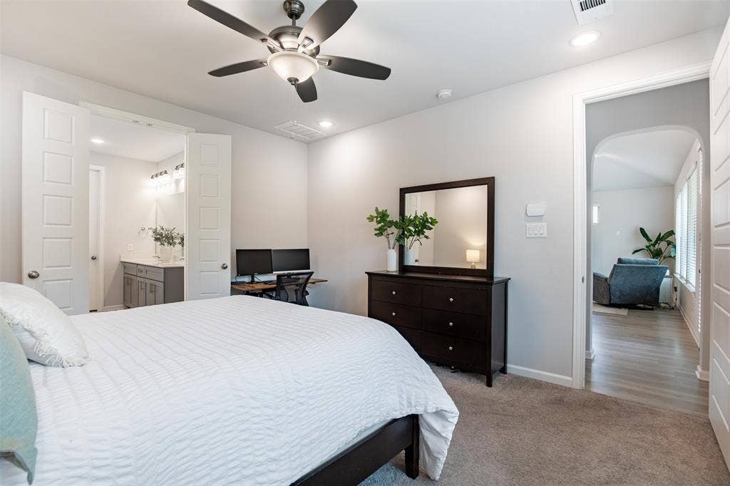 Primary suite situated privately from secondary bedroom.