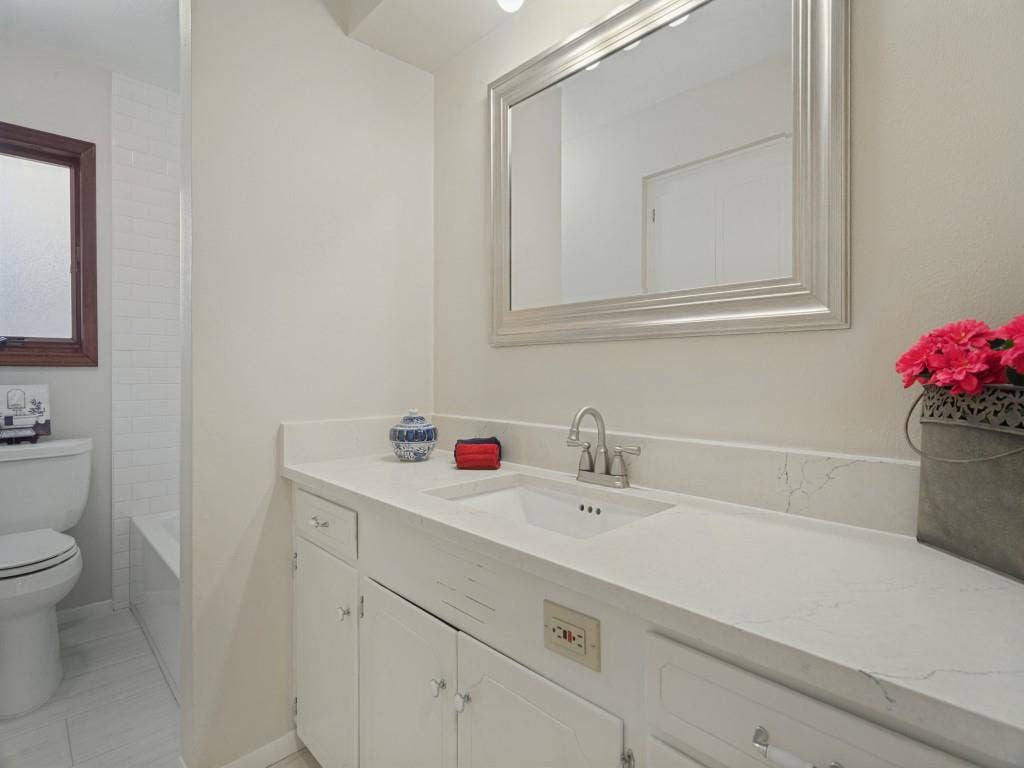 2912 Linden Lea, Irving, TX 75061 Updated Hall Bath with stone counters & tons of storage