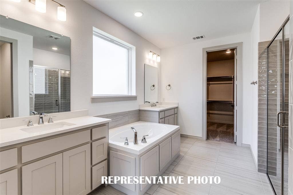 1405 Mistflower Lane, Celina, TX 75009 Plenty of space for two in this wonderful owner's bath. REPRESENTATIVE PHOTO