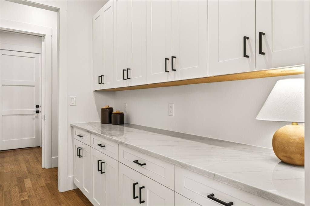 1217 Whisper Rock Drive, Rockwall, TX 75032 Butler's pantry directly behind kitchen provides excellent storage and saves counter space