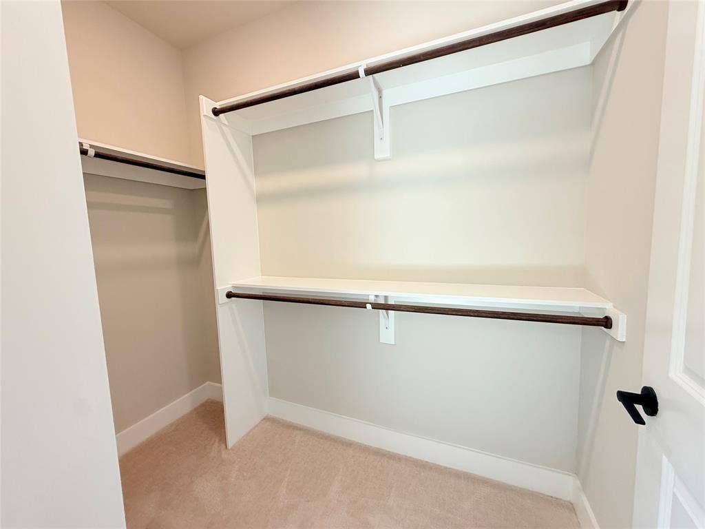 3255 Carlisle Street, #1207, Dallas, TX 75204 Walk in closet featuring light colored carpet