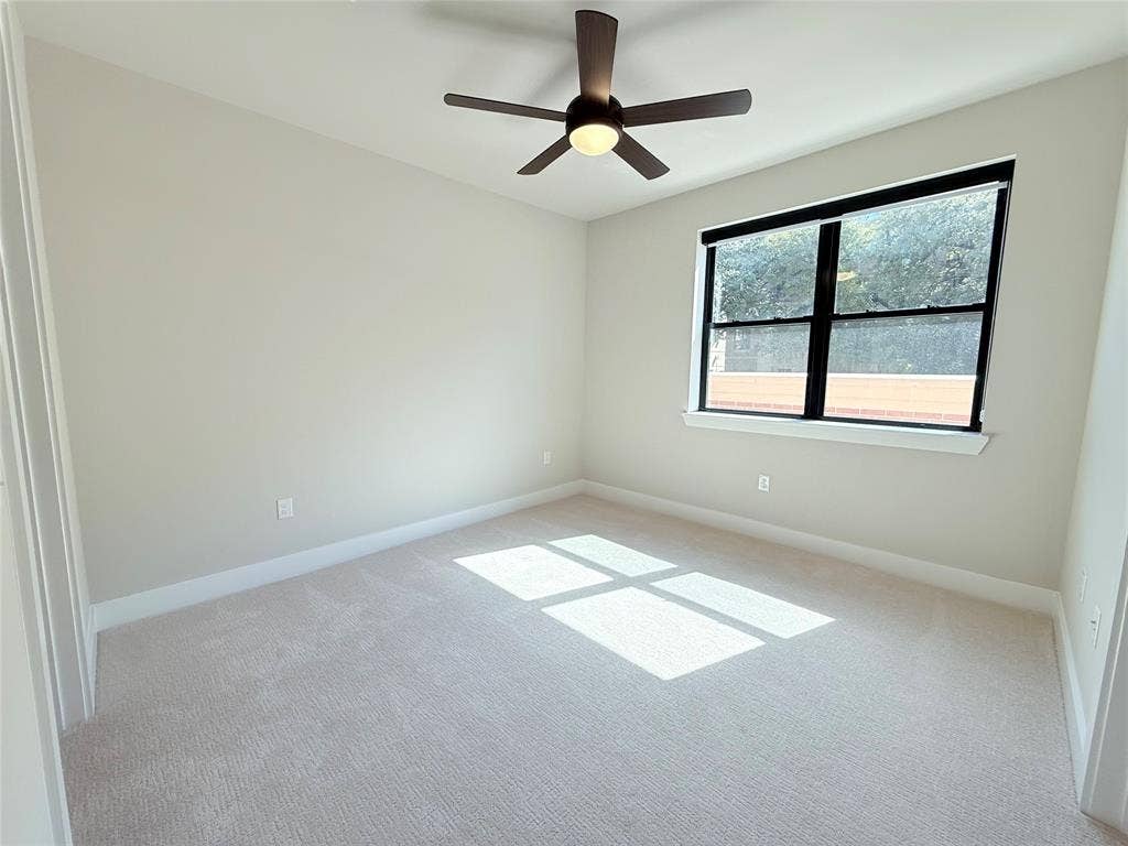 3255 Carlisle Street, #1207, Dallas, TX 75204 Unfurnished room with a ceiling fan and carpet