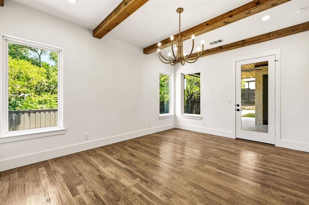1222 Whisper Rock Drive, Rockwall, TX 75032 Wood beams, large windows and direct access to covered patio