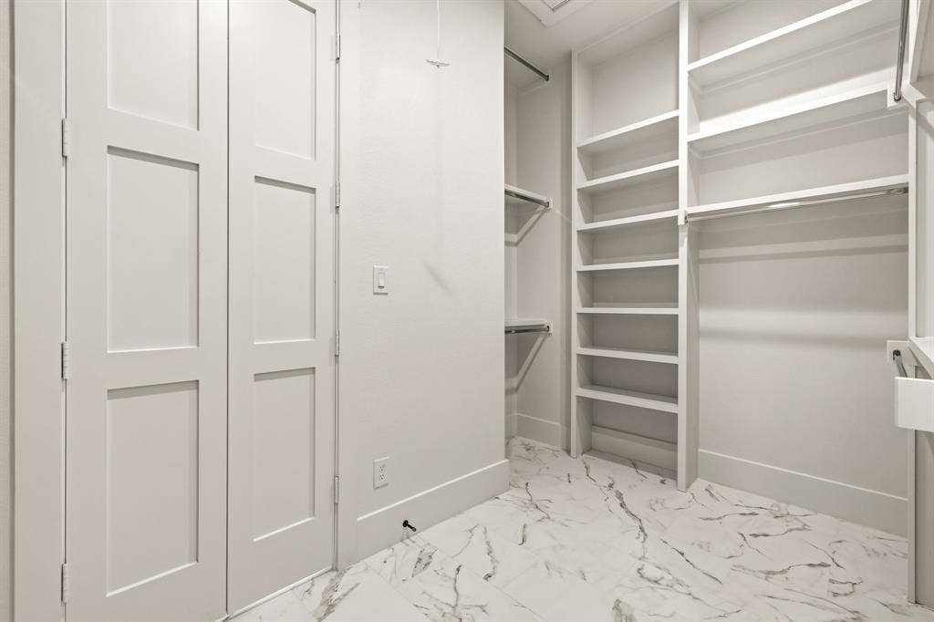 1222 Whisper Rock Drive, Rockwall, TX 75032 Oversized primary bedroom closet with direct access to laundry room
