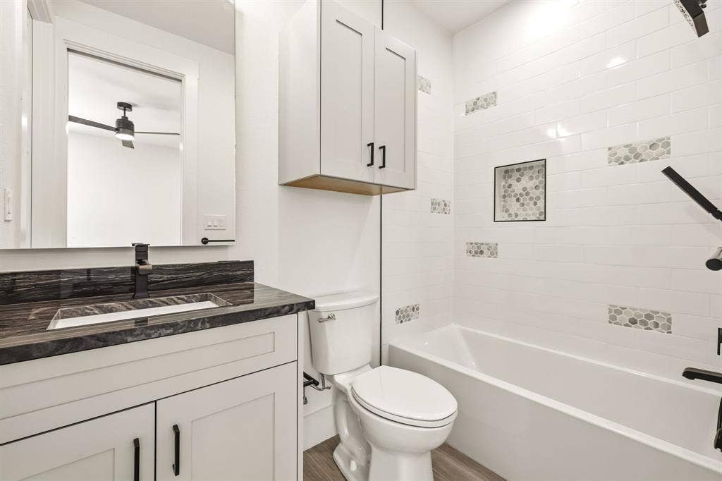 1222 Whisper Rock Drive, Rockwall, TX 75032 Ensuite bathroom to upstairs bedroom 2. Access to walk in attic storage