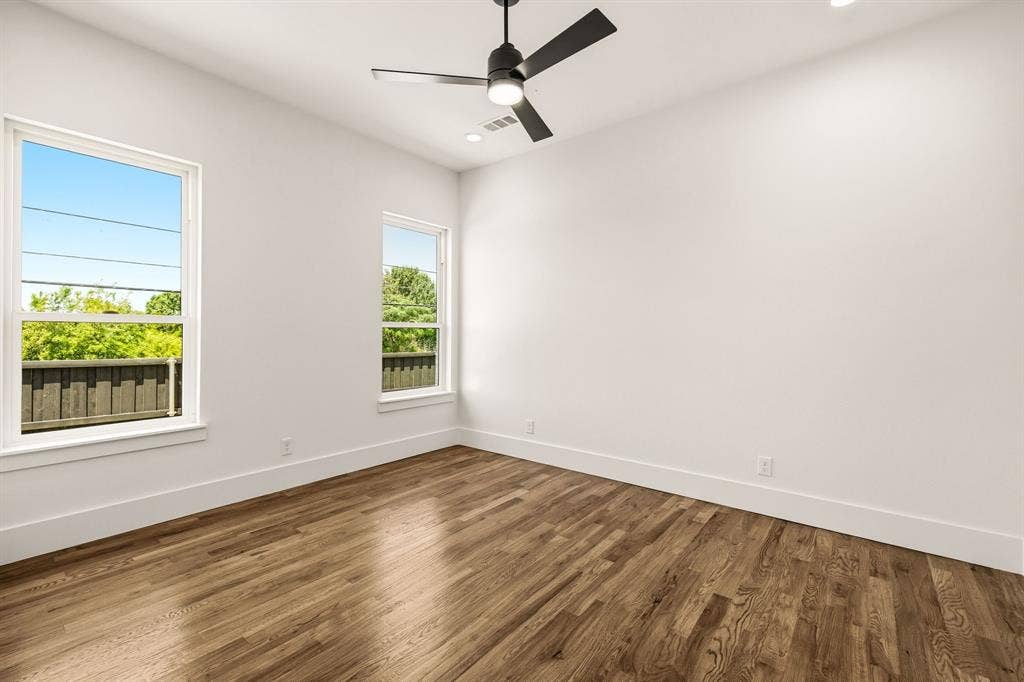 1222 Whisper Rock Drive, Rockwall, TX 75032 Secondary bedroom downstairs with hardwoods - great for guest bedroom or MIL