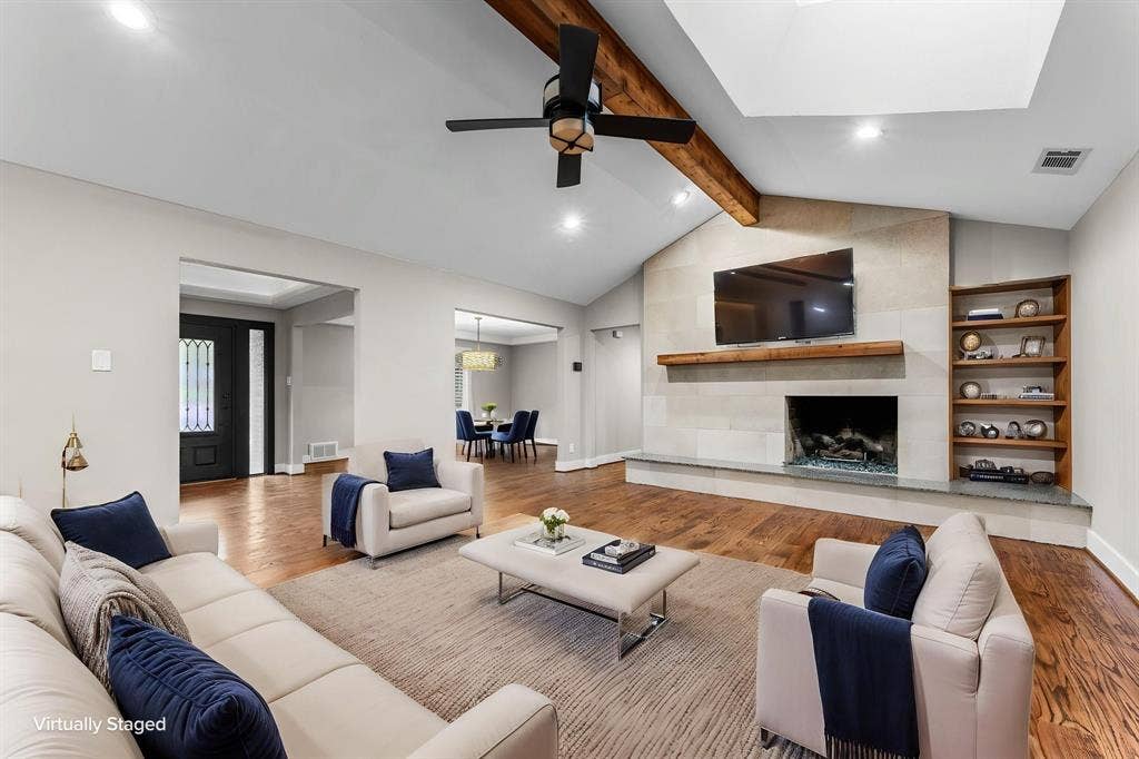 9656 Ravensway Drive, Dallas, TX 75238 Virtually staged living room and FP