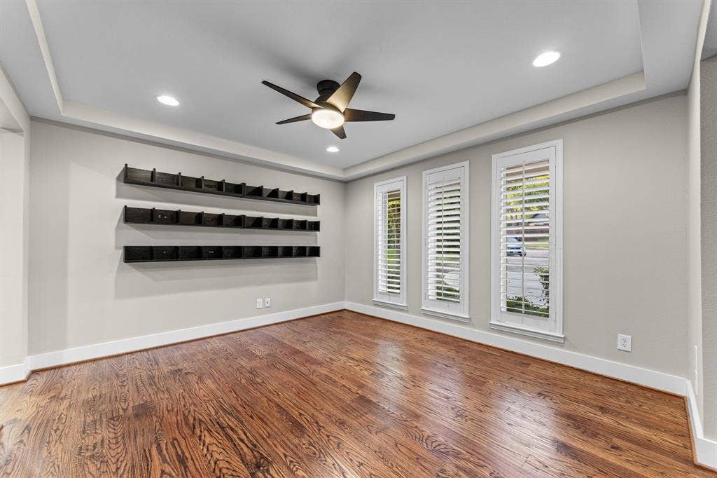 9656 Ravensway Drive, Dallas, TX 75238 Office with tray ceiling featuring recessed lighting