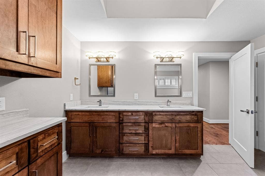 9656 Ravensway Drive, Dallas, TX 75238 Plenty of storage with the large 2 sink vanity and the extra cabinets
