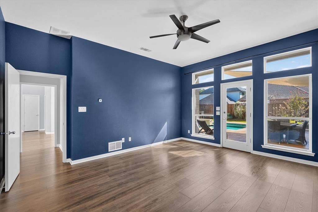 4420 Hollow Oak Drive, Dallas, TX 75287 Primary bedroom downstairs with patio access.