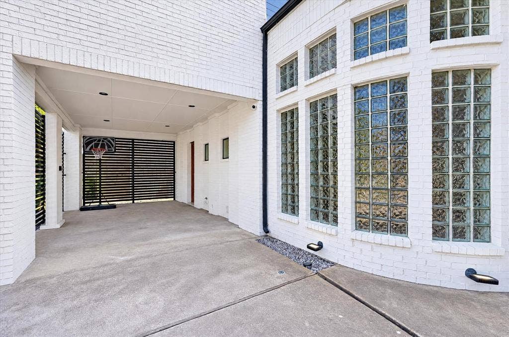 4420 Hollow Oak Drive, Dallas, TX 75287 One car covered parking off the circular drive in front. Door access to kitchen.