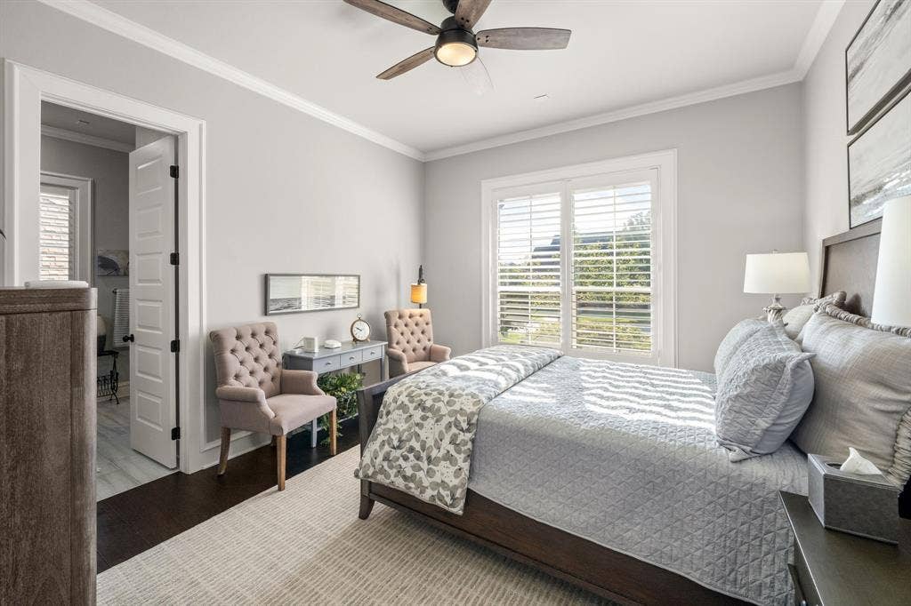 7609 Timber Trail, Tyler, TX 75703 Room featuring dark wood-finish flooring, white plantation shutters, crown molding, and a multi-blade ceiling fan with integrated lighting