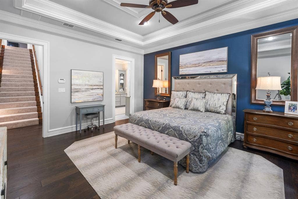 7609 Timber Trail, Tyler, TX 75703 Tray ceiling, dark wood-finish flooring, and a deep blue accent wall
