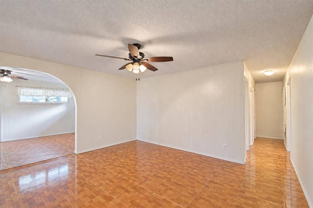 1910 R Avenue, Plano, TX 75074 Interior space featuring an arched entryway, tile flooring, and a ceiling fan with integrated lighting