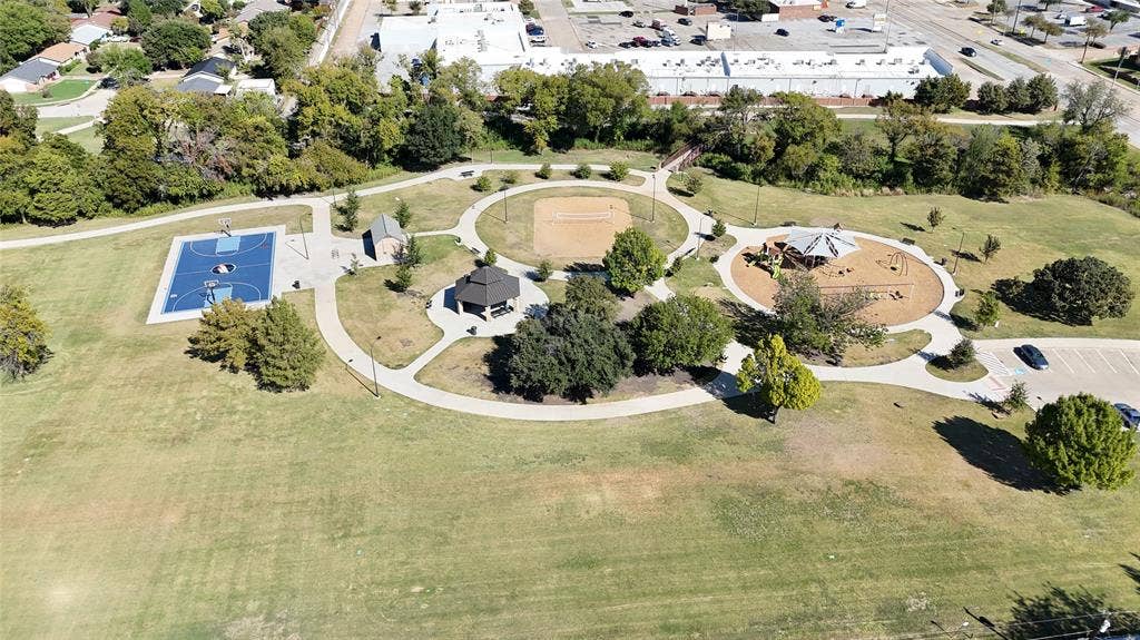 1910 R Avenue, Plano, TX 75074 Public park featuring a basketball court, sand volleyball court, playground, gazebo, and paved walking paths
