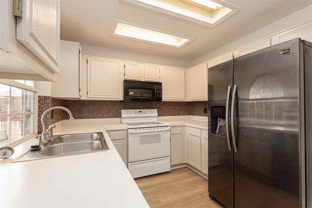 1321 Hall, Seagoville, TX 75159 Freshly painted cabinets and updated flooring