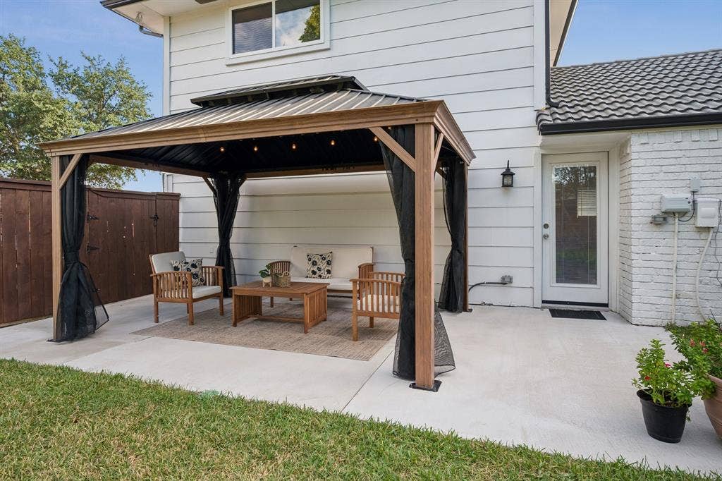 218 High Brook Drive, Richardson, TX 75080 Delight in a shaded gazebo equipped with power and fans, plus an irrigation system covering all three lawn areas and flower beds.