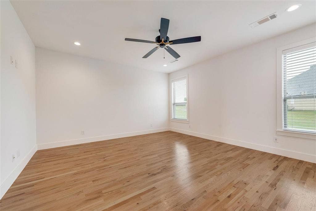 1001 Devoss Court, Caddo Mills, TX 75135 Neutral interior featuring wood-finish flooring, recessed lighting, and a dark-finish ceiling fan