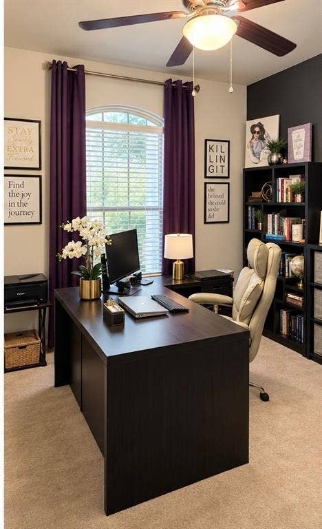 Arched window with wood-finish blinds, built-in shelving, carpeted flooring, and a ceiling fan with integrated lighting