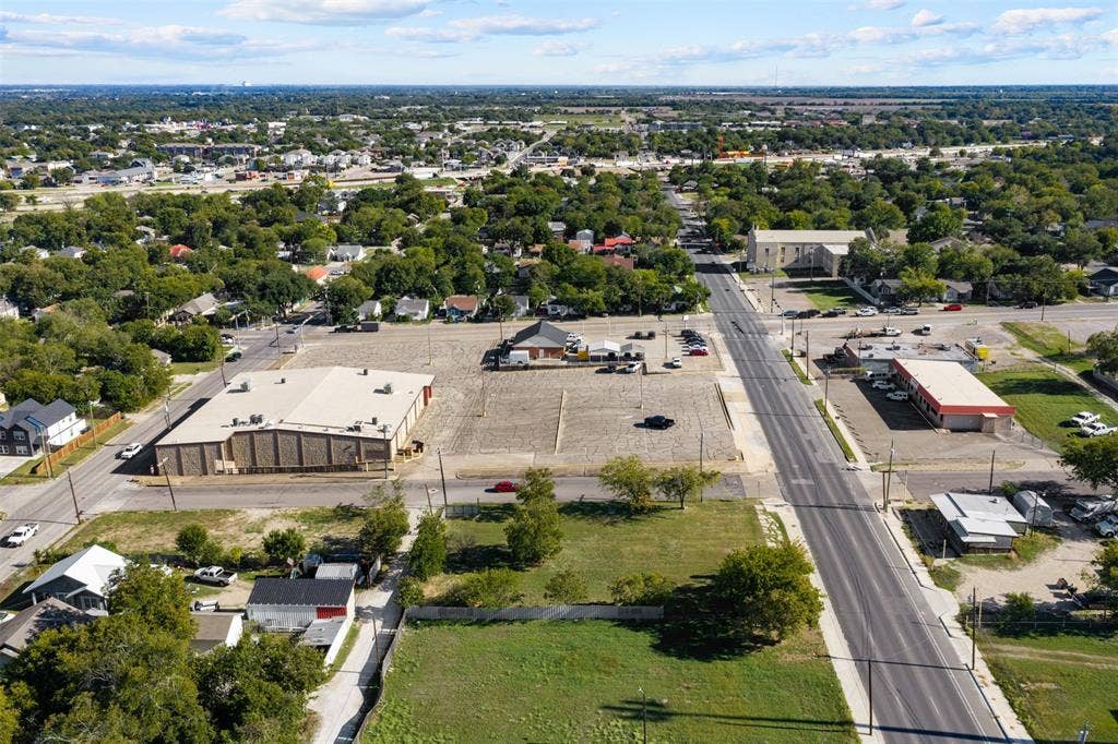 920-928 S 18th Street, Waco, TX 76706 Aerial perspective of a corner lot featuring direct paved road access, expansive cleared terrain, and proximity to established commercial infrastructure