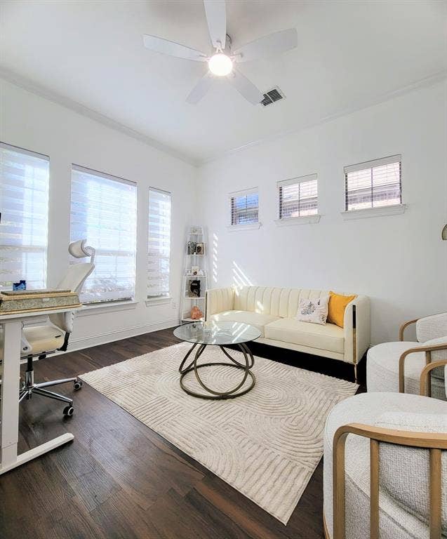 4308 Lee Hutson Drive, Sachse, TX 75048 Room featuring dark wood-finish flooring, a neutral color palette, three large windows, three transom windows, and a ceiling fan with integrated lighting