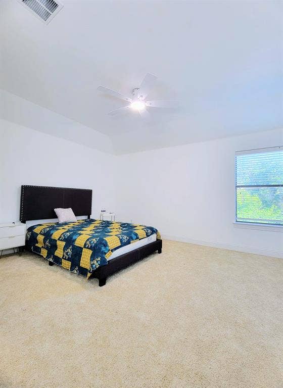 4308 Lee Hutson Drive, Sachse, TX 75048 Room featuring a tray ceiling, wall-to-wall carpeting, neutral wall color, and a ceiling-mounted fan with an integrated light fixture