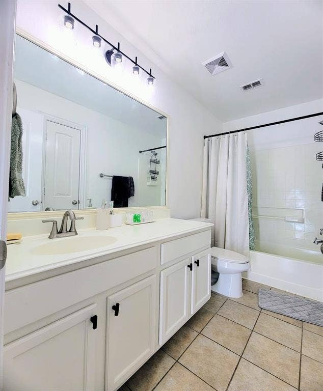 4308 Lee Hutson Drive, Sachse, TX 75048 Bathroom featuring a vanity with white cabinetry, a large integrated countertop sink, a multi-bulb light fixture, a full-width mirror, and a tile floor