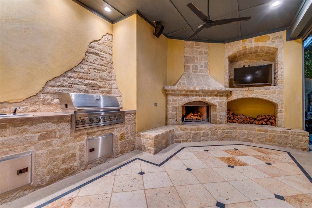 6131 Park Lane, Dallas, TX 75225 Outdoor kitchen, entertainment area with fireplace and screens