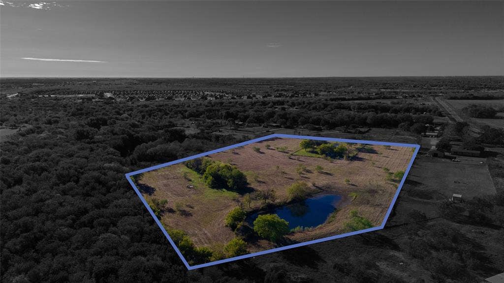 212 Old Wagon Road, Royse City, TX 75189 Expansive acreage featuring a private pond, open pasture, and mature trees