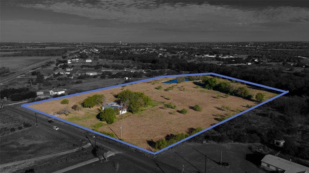 212 Old Wagon Road, Royse City, TX 75189 Expansive acreage featuring mature trees, a pond, and a detached structure