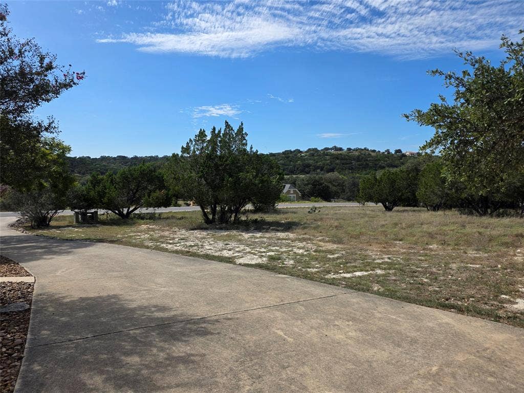 570 MysticShores Boulevard, Spring Branch, TX 78070 View of the lot from neighbor's driveway