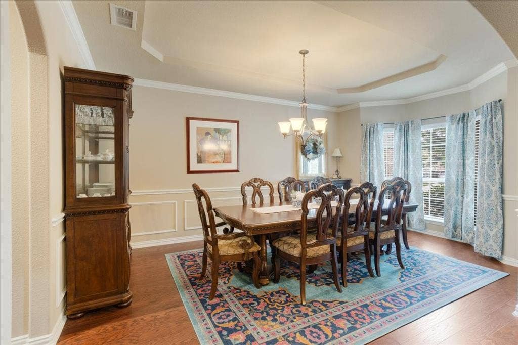 319 Westphalian Drive, Celina, TX 75009 Formal dining area featuring rich wood-finish flooring