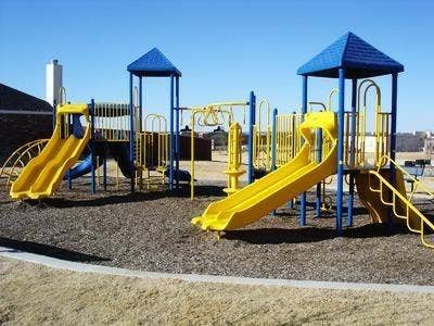 319 Westphalian Drive, Celina, TX 75009 Outdoor play area featuring two slide structures with blue and yellow accents