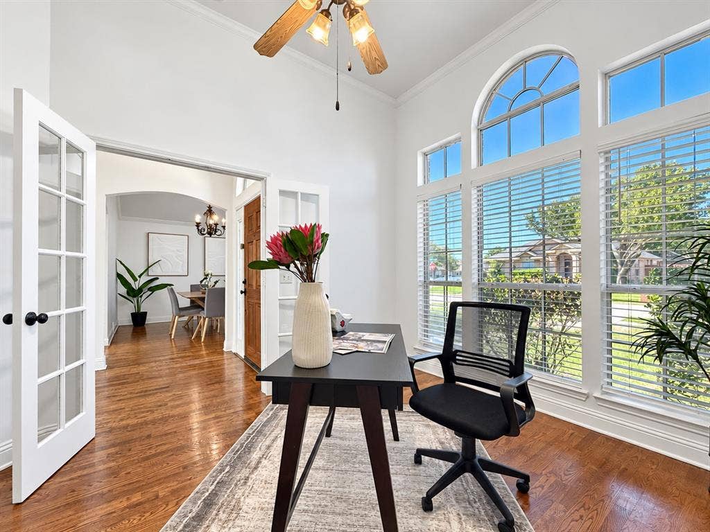 7514 Naples Lane, Frisco, TX 75035 High ceilings, arch-top windows, wood-finish flooring, and French doors featuring glass panes