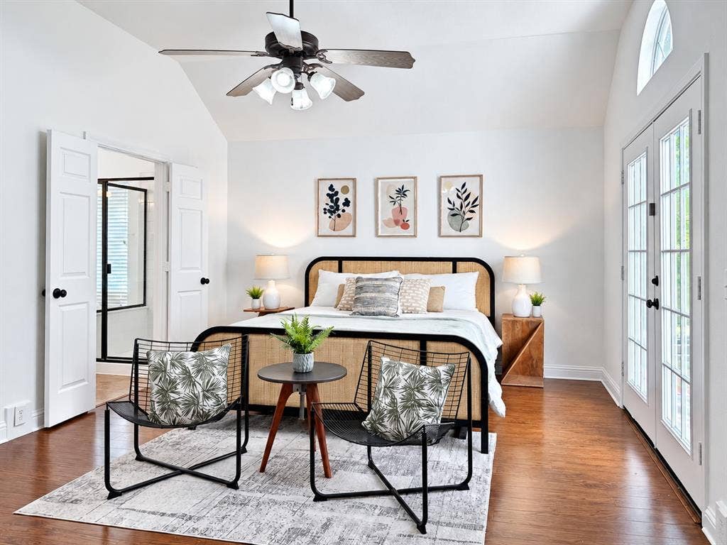 7514 Naples Lane, Frisco, TX 75035 Vaulted ceiling, wood-finish flooring, French doors with glass panes, and a multi-light ceiling fan