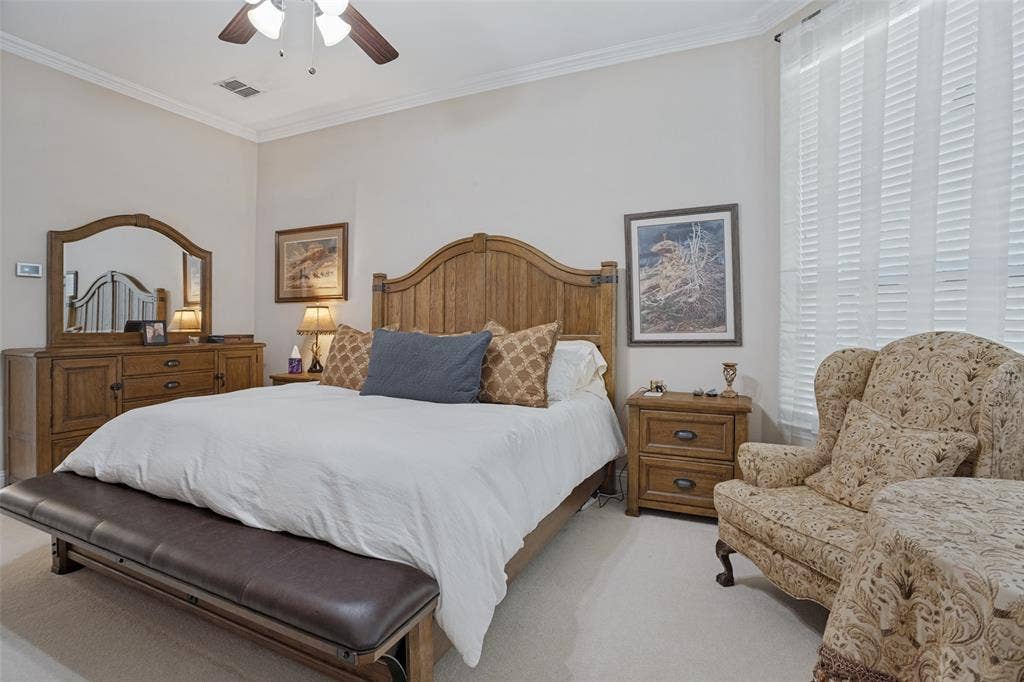 701 Crabapple Way, McKinney, TX 75072 Neutral-toned interior space featuring high ceilings with crown molding and a central ceiling fan with integrated lighting