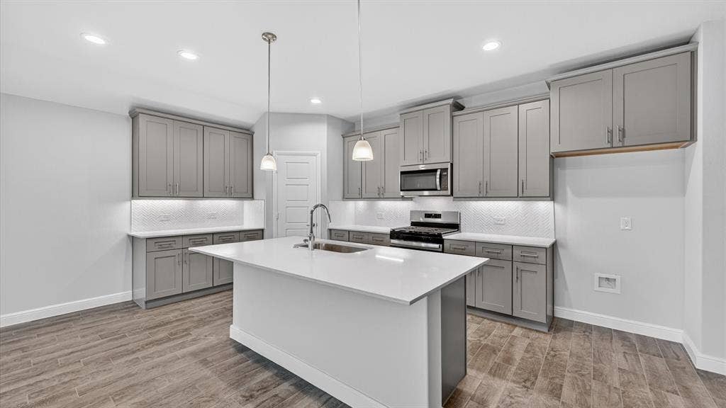 10425 SUNSET SHORE Drive, Grand Prairie, TX 76065 Kitchen - All Home and community information, including pricing, included features, terms, availability and amenities, are subject to change at any time without notice or obligation. All Drawings, pictures, photographs, video, square footages, floor plans, elevations, features, colors and sizes are approximate for illustration purposes only and will vary from the homes as built.