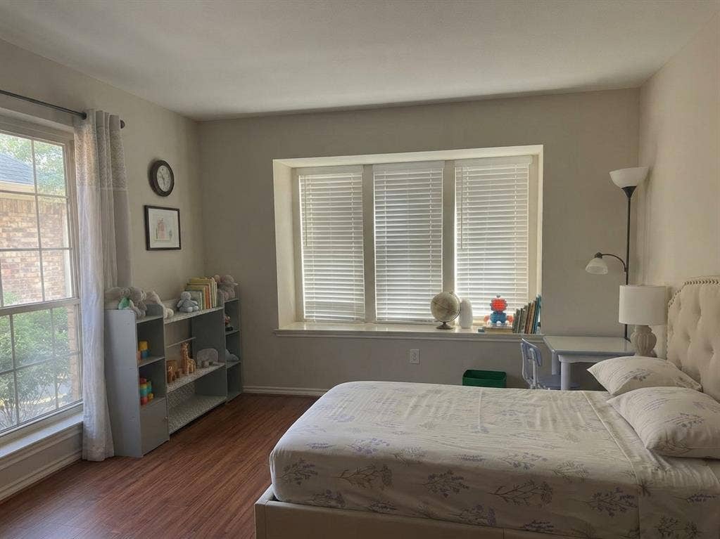 6011 Highplace Circle, Dallas, TX 75254 Wood-finish flooring, recessed window alcove with integrated sill, and two sets of windows featuring horizontal blinds