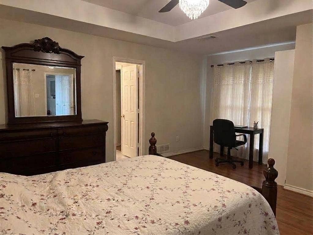 6011 Highplace Circle, Dallas, TX 75254 Tray ceiling, wood-finish flooring, and multi-light chandelier ceiling fan